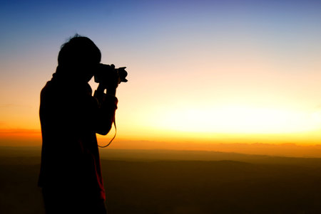 silhouettes photography on mountain, in sunset