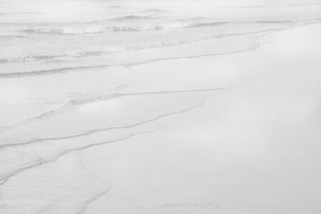 Soft wave ocean on sand beach. Background or textureの写真素材