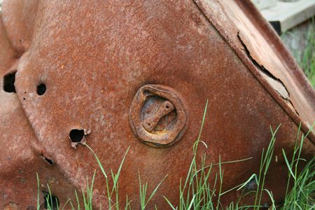 an image of a Rusty 50 gallon Drum with bullet holesの写真素材