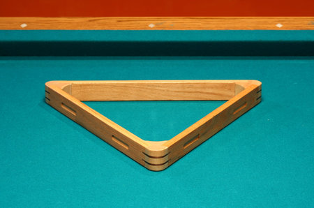 Empty 8 ball rack on a pool table