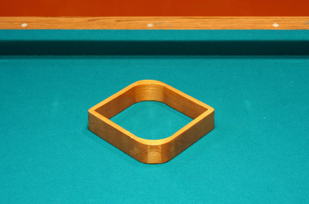 Empty 9 ball rack on a pool table