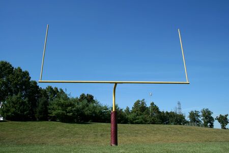 A Football goal post against a blue skyの写真素材