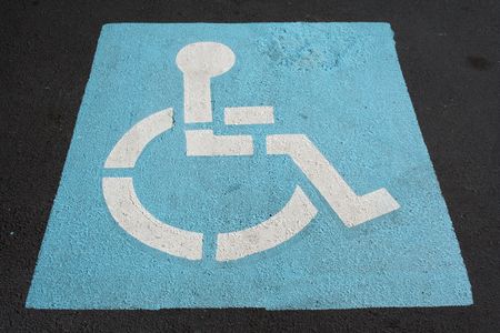 A Handicapped sign painted in a parking spotの写真素材