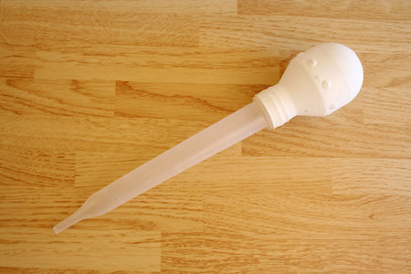 Turkey baster on a wooden tableの写真素材