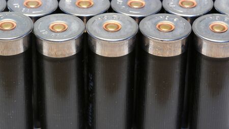 12 gage black shotgun shells background imageの写真素材