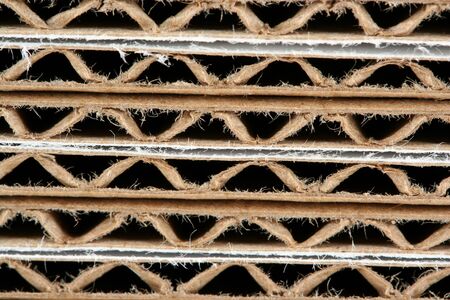 A Stacked corrugated cardboard boxes macro backgroundの写真素材