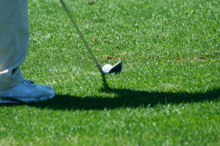 A Golfer addressing the ball