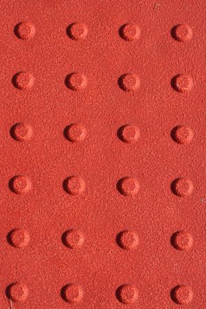 A Red sidewalk non slip pad backgroundの写真素材