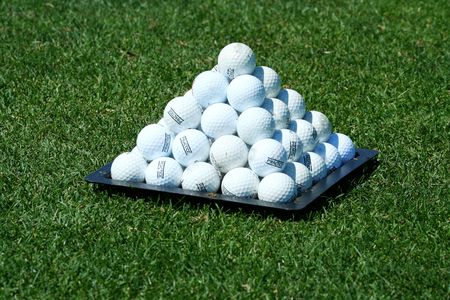 A Pyramid of practice golf ballsの写真素材