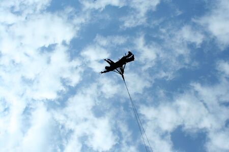 Amusement park bungee ride silhouetteの写真素材