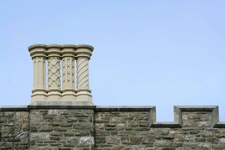Some old chimneys on a roofの写真素材