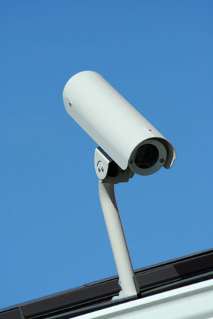 A Securilty camera on the roof of a building