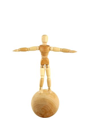 A Wooden manikin standing on ballの写真素材