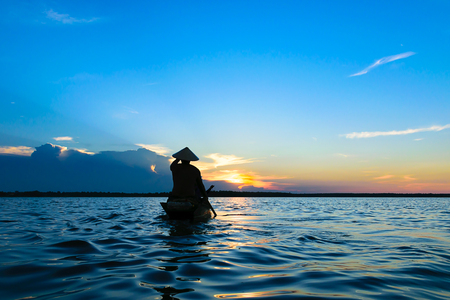 Fisherman are fishing the river in Thailand.の写真素材