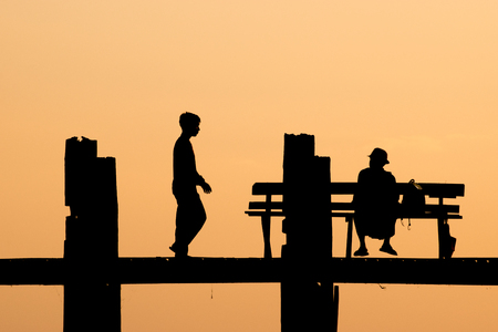 U Bein Bridge during sunset, silhouetteの写真素材