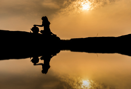 Girl with dog, New friendship at sam pan bok, Ubon Ratchathani, Thailandの写真素材