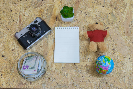 Planning of traveling vacation journey element flat lay on wood background.の写真素材