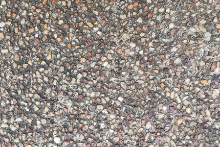 Small Rock Dust Crushed Pebble on Concrete Floor Background. Macro close-up rough surface construction groundの写真素材