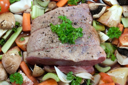 Beef with vegatables ready to oven roastの写真素材