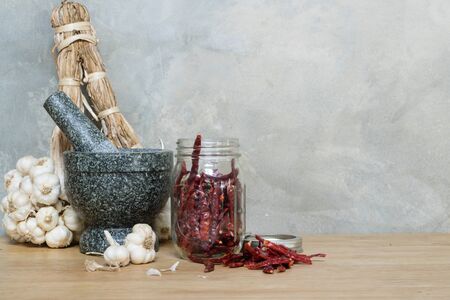 thai chilli garlic mortar on wooden tableの写真素材