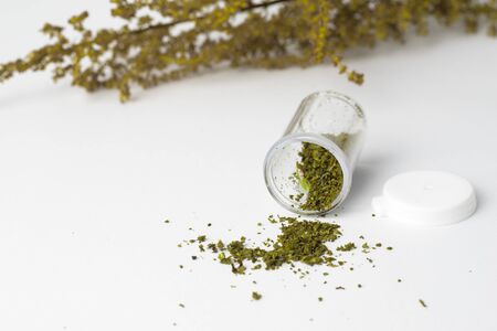 marijuana in medicine bottle on white background,soft focus herbの写真素材