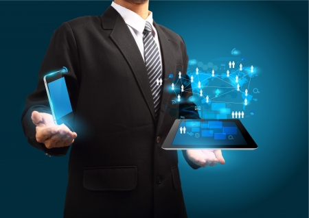 Modern wireless technology and social media concept, Mobile phone with tablet computer in the hand Modern wireless technology and social media concept, Mobile phone with tablet computer in the hand