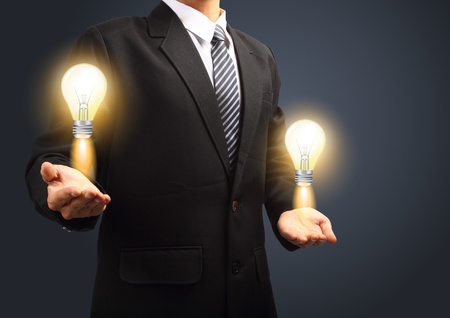 Holding light bulb power of thinking and successful creative idea  の写真素材