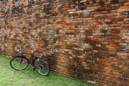 Vintage bicycle and red brick wall, vintage bike  Retro stylish cycling in townの写真素材