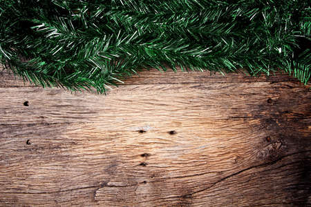 Christmas fir tree on a wooden boardの写真素材
