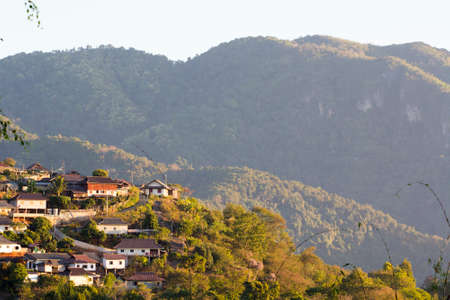 Village on the hill at Chiang Rai city in Thailandの写真素材