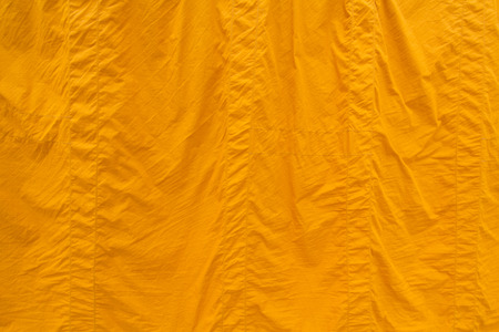 Yellow fabric texture background, Clergy robe in Buddhismの写真素材
