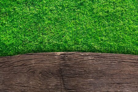 wooden with green grass backgroundの写真素材