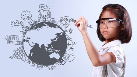Little girl creative drawing on global environment with ecology happy family stories concept ideaの写真素材