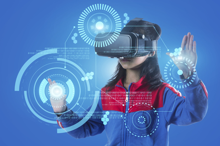 Girl with glasses of virtual reality. Future technology concept.の写真素材