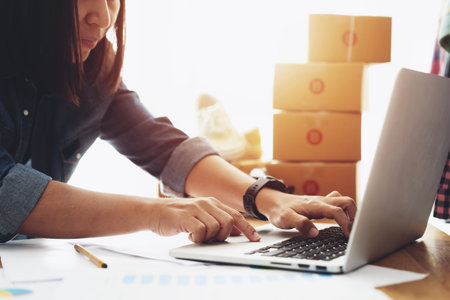Women using laptop selling online work from home, e-commerce shipping idea concept freelance start...