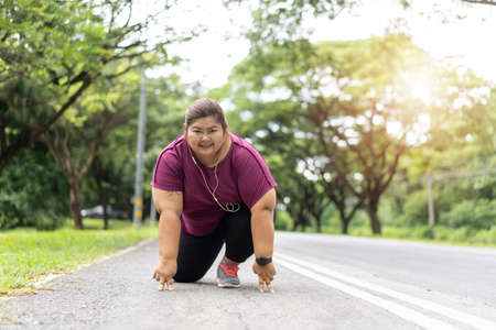 Fat woman asian ready to run, Does exercise for weight loss idea concept.の写真素材