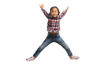 Funny asian child girl jumping isolate on white background.
