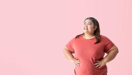 Fat woman thinking and looking, isolated on pink background. Clipping paths for design work empty...