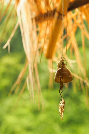 gold bell in temple with blurred backgroundの写真素材