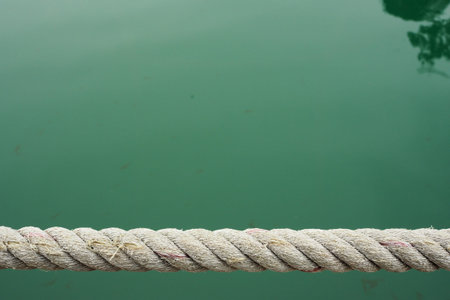 straight rough rope over water