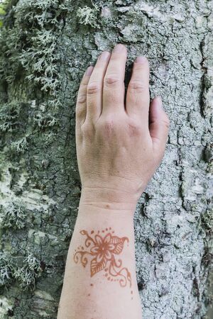 Her hand with the tattooの写真素材