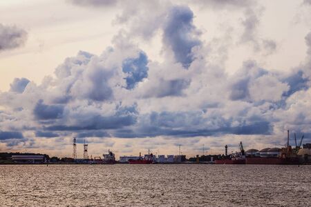 very beautiful colors in the evening sunlight shines on the ships in portの写真素材