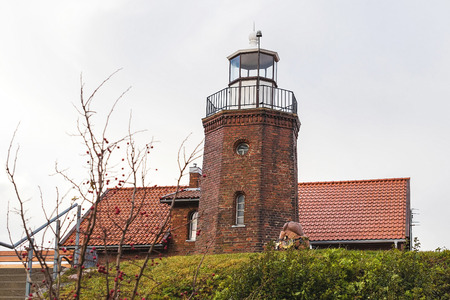 from the old brown brick lighthouse at seaの写真素材