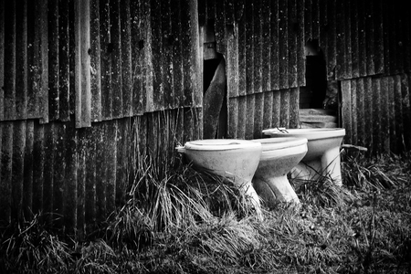 to the barn wall were three white potsの写真素材