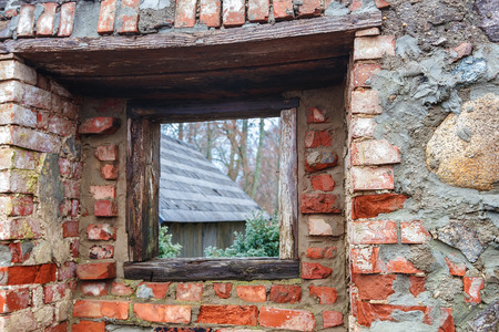 in the old brick wall of trees and lightの写真素材