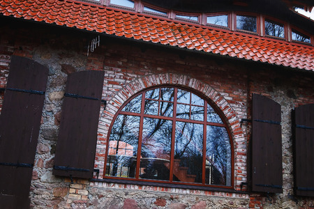 in the old brick wall of trees and lightの写真素材