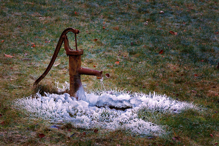 in winter in the middle of the field from the pimple water dripping waterの写真素材