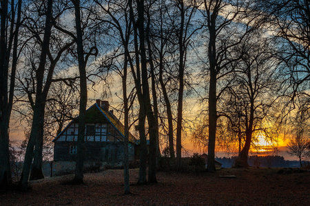 the sun is setting over the fields an orangeのeditorial素材