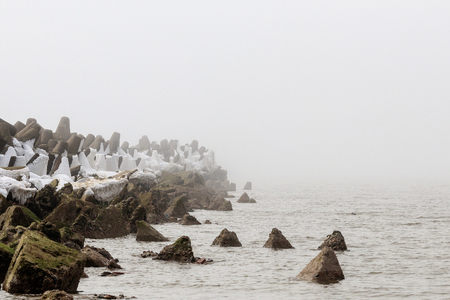 Latvia The ruined forts of the Carport stand in a baffling mistの写真素材