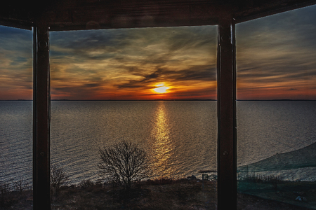 A very beautiful, colorful sunset over a blue seaの写真素材